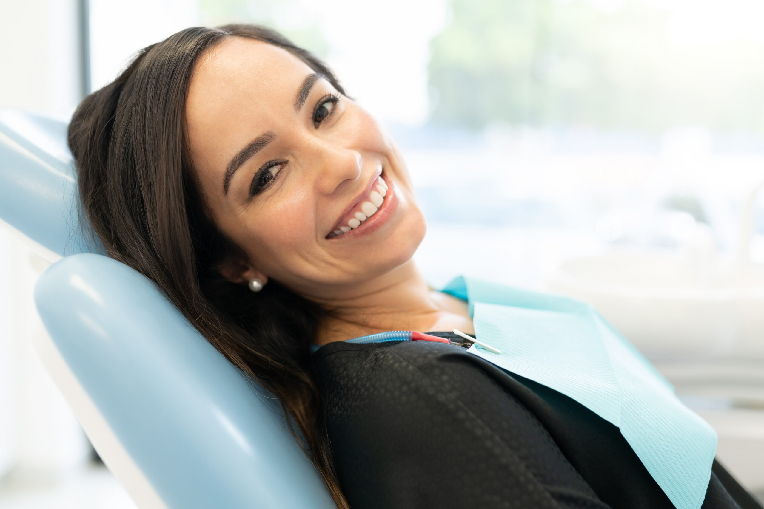 Dental patient at checkup receiving composite filling treatment at Satilla Family Smiles